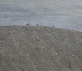 Helicopter landing near the volcano.